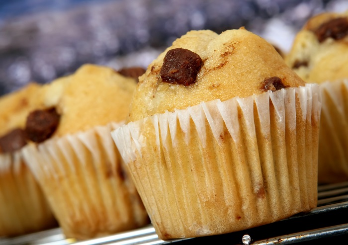 Golden chocolate chip muffins baked in the kitchen